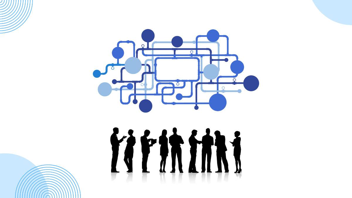 Group of diverse alumni networking and collaborating at a university event, symbolizing the benefits of alumni network.